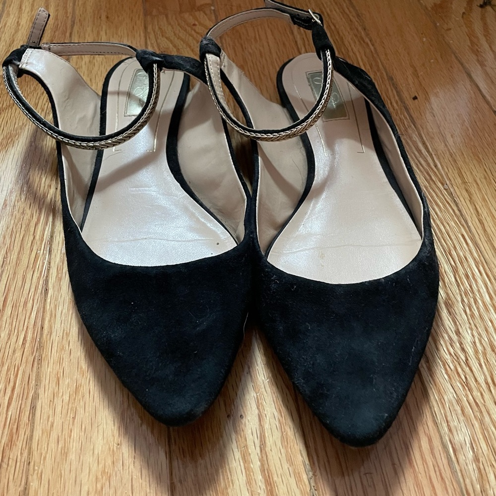 Black flats with gold ankle wrap